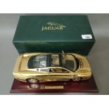 Model of Jaguar XJ220 22ct gold plated car, boxed with certificate, made by GWILO Limited Edition.