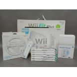 A Nintedo Wii console, Wii Fit Plus board, various games and accessories.