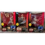 Three large boxed Star Wars toys.