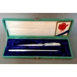 A boxed desk set of two hallmarked Japanese silver items to include letter opener.