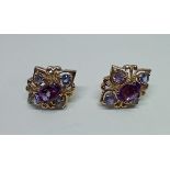 A pair of 9ct gold amethyst and tanzanite earrings, gross weight 2.43 grams.
