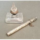 A cut glass perfume bottle with silver collar and a hallmarked silver pen holder.