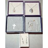 Four silver necklaces, lengths 45cm, pendants comprising crucifix, locket, filigree and coral,
