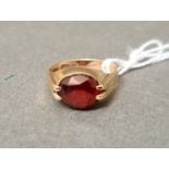 A hallmarked 9ct gold ring set with red paste, size M/N, gross wt. 3.55g.