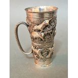 Anglo-Indian double ended drinks measure, white metal with repoussé scenes of wild animals, gross