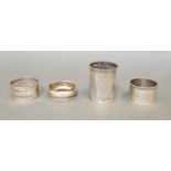 Hallmarked silver comprising three serviette rings and a match holder, gross wt. 59.4g.