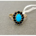 A hallmarked 9ct gold turquoise and sapphire ring, size M, gross wt. 2.4g.