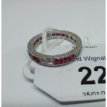A synthetic ruby and sapphire full eternity ring, engraved outer edge, channel set princess cut