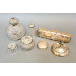 Assorted hallmarked silver comprising a brush, cut glass bottles, ring tree, etc.