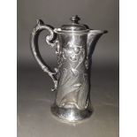 An Art Nouveau silver plated lidded jug, circa 1900, height 23cm.