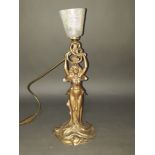 An Art Nouveau spelter lamp with later John Ditchfield glass shade, height 43cm.