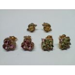 Three pairs of 9ct gold earrings, various settings to include green sapphire, yellow sapphire and