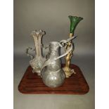 A French Art Nouveau pewter vase by Etain Garanti with Louvre stick to base, height 26cm, together