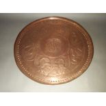 An Arts & Crafts embossed and hammered plaque, dated 1904, diameter 51cm.