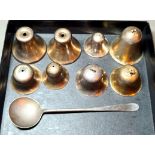 A set of silver bells and a silver spoon, various marks, gross weight 3.9 ozt.