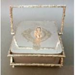 A Victorian serving dish, white metal mounted frosted glass, in the rustic manner and surmounted