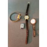 A 9ct gold cased watch with 9ct gold on silver flexi strap together with a Lorus, an Ingersoll and