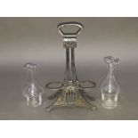 A WMF silver plated cruet stand with two non matching glass bottles, height 25cm.