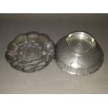 Two pieces of Art Nouveau pewter comprising a French strawberry dish designed by Maurice Petit for