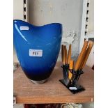 A blue art glass vase and a set of Art Deco cheese knives with Solinger blades, bakelite handles and