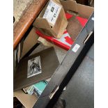 A box of mixed ephemera, postcards, medals, tea cards etc