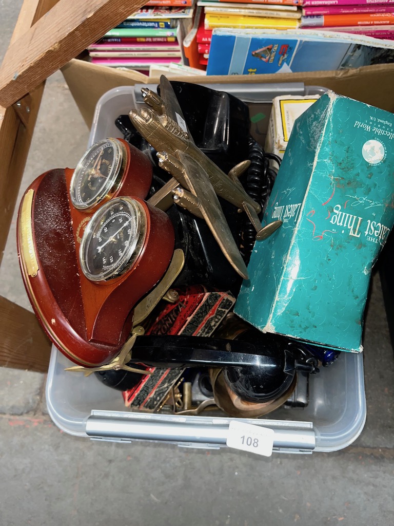 A box of assorted items including model planes, telephone, met etcalware, Harmonica, glassware