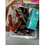 A box of assorted items including model planes, telephone, met etcalware, Harmonica, glassware