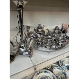 A silver plate epergne, height appx 41cm, a plated oval tray with 4 piece plated tea set