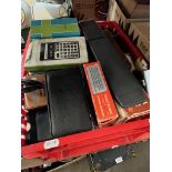 A box of vintage calculators.