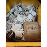 A box of loose cigarette cards