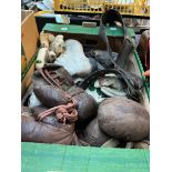 A box of vintage leather sports equipment - boxing gloves. ice skates, cricket gloves etc