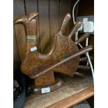 A vintage carved wooden turkey knife block