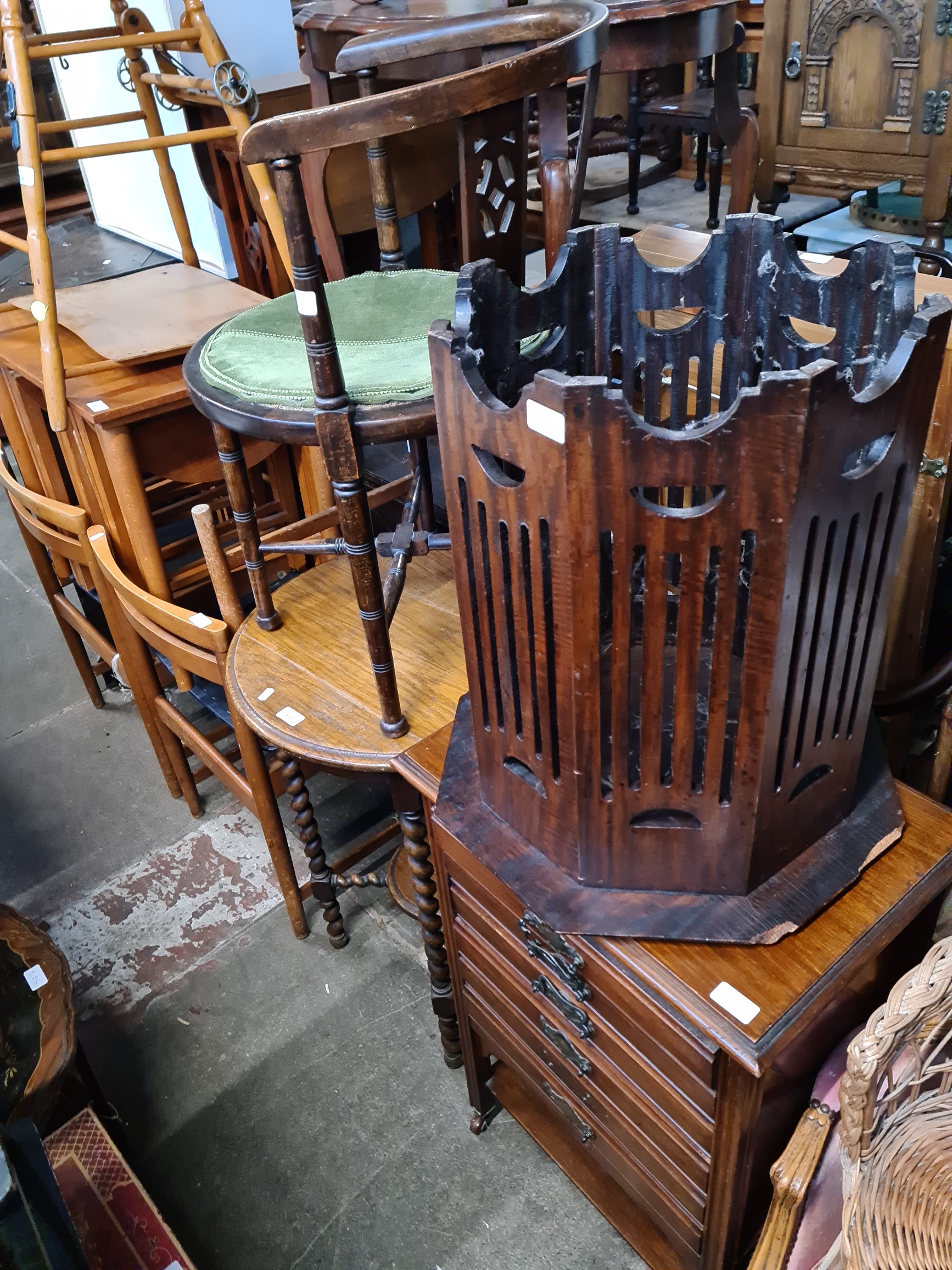 Four pieces of furniture; an Edwardian mahogany music cabinet, a tub chair, an oak twist leg table