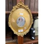 A 19th century miniature portrait of a lady, in gilt oval frame.