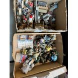 Two boxes of ornaments including Wade Whimsies Village models, animal, light houses etc.