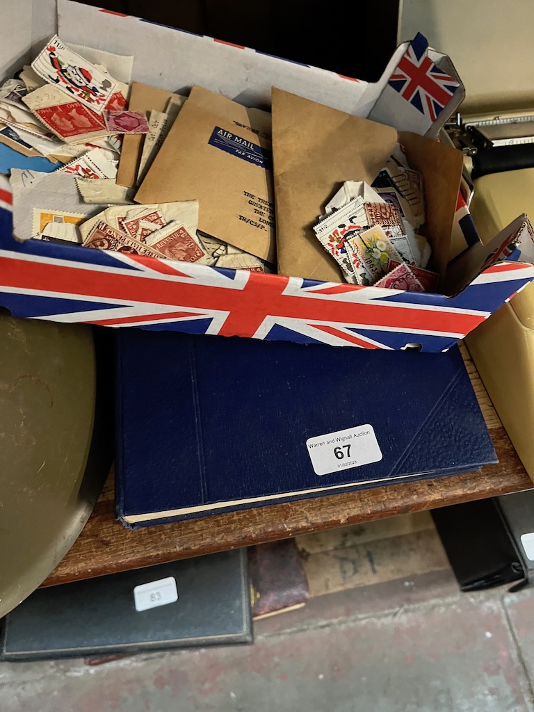 A box of unsorted vintage used stamps including GB and world plus a 'Strand' stamp album with