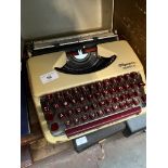 A vintage Olympia Splendid 33 portable typewriter.