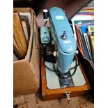 A cased Brother electric sewing machine with power lead and pedal etc