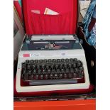 A vintage Daro Erika portable typewriter.