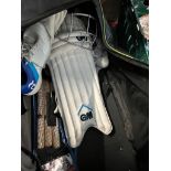 A holdall of cricket gear including helmet, Kookaburra shoes, pads etc