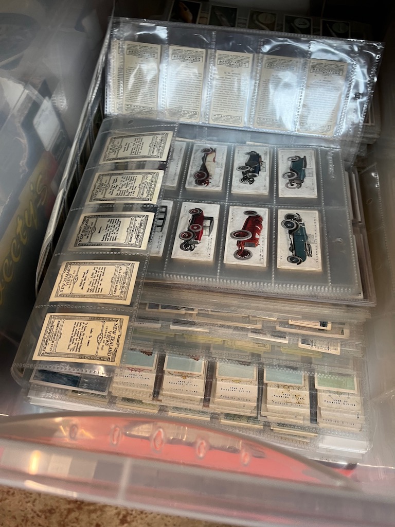 A box of various sleeved cigarette cards