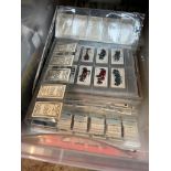 A box of various sleeved cigarette cards