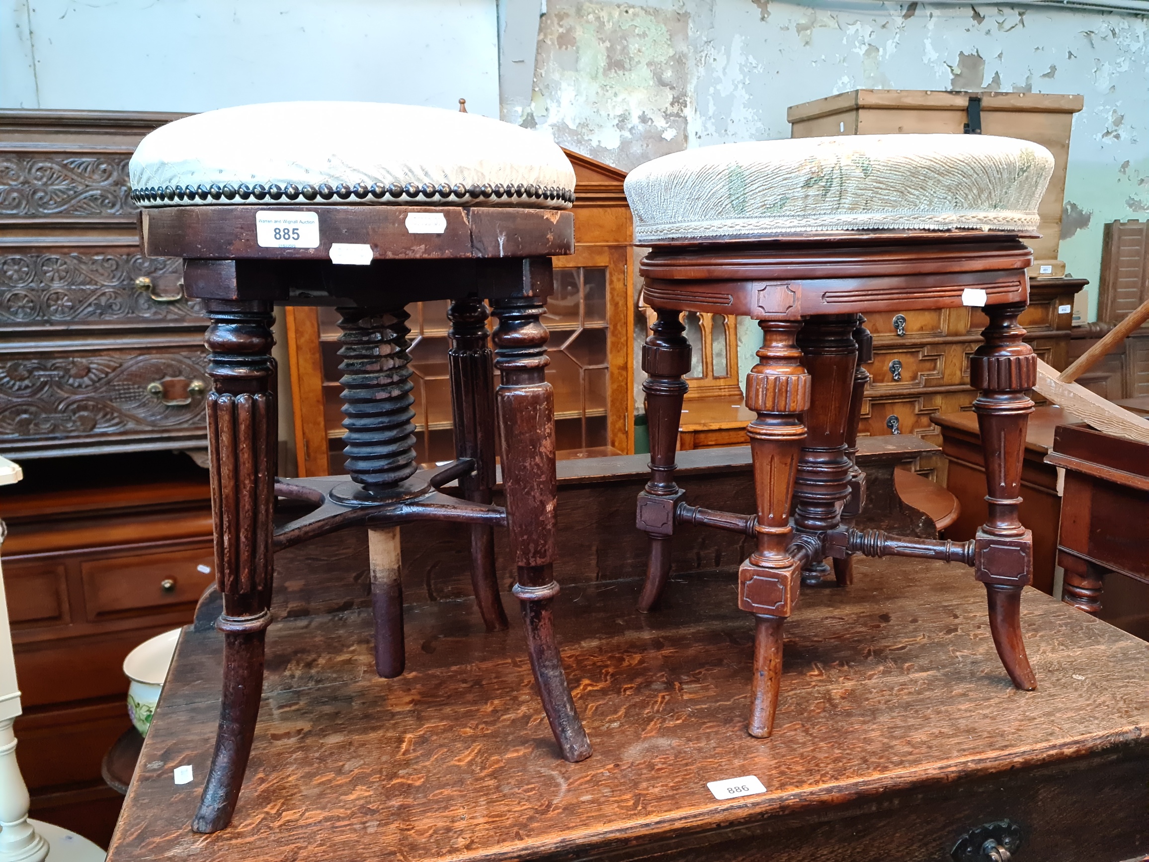 Two Victorian mahogany adjustable piano stools.