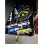 A box of sporting equipment including darts and boards, badminton racquets and shuttles etx