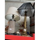 A brass column table lamp and another.