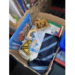 A box of various sporting memorabilia