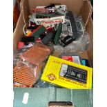 A box of model railway items.