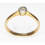 A diamond solitaire ring, the bezel set old European cut stone weighing approx. 0.18ct, band