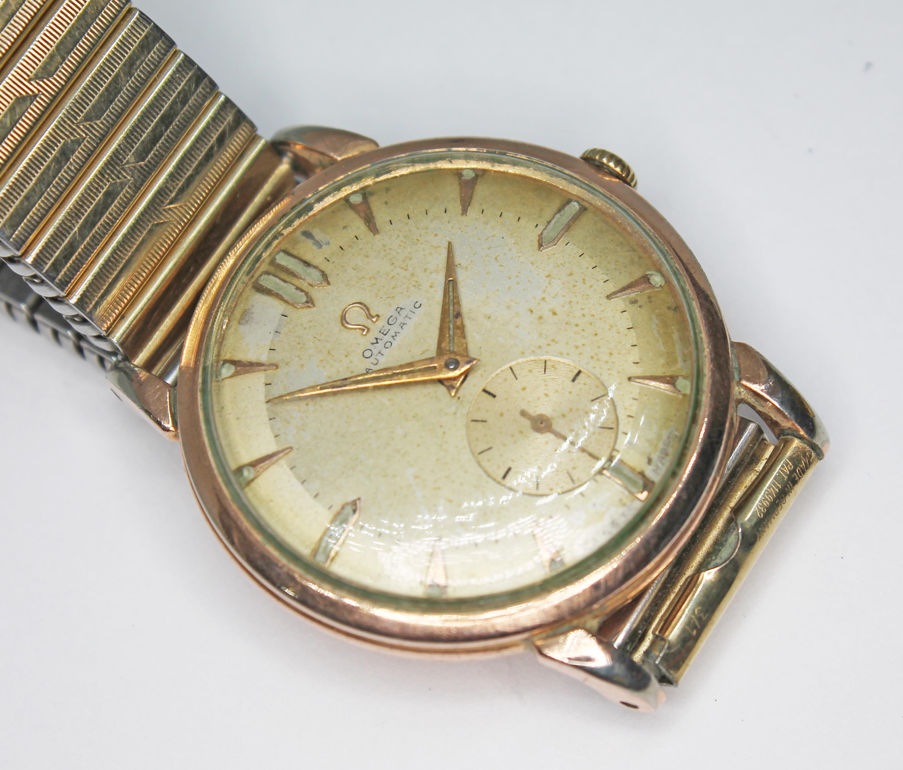 A vintage gold plated Omega automatic wristwatch, ref. 2398, cal. 332, signed champagne dial with