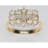 A diamond cluster ring, the cluster measuring approx. 15.60mm x 10.90mm, band marked '18K', gross